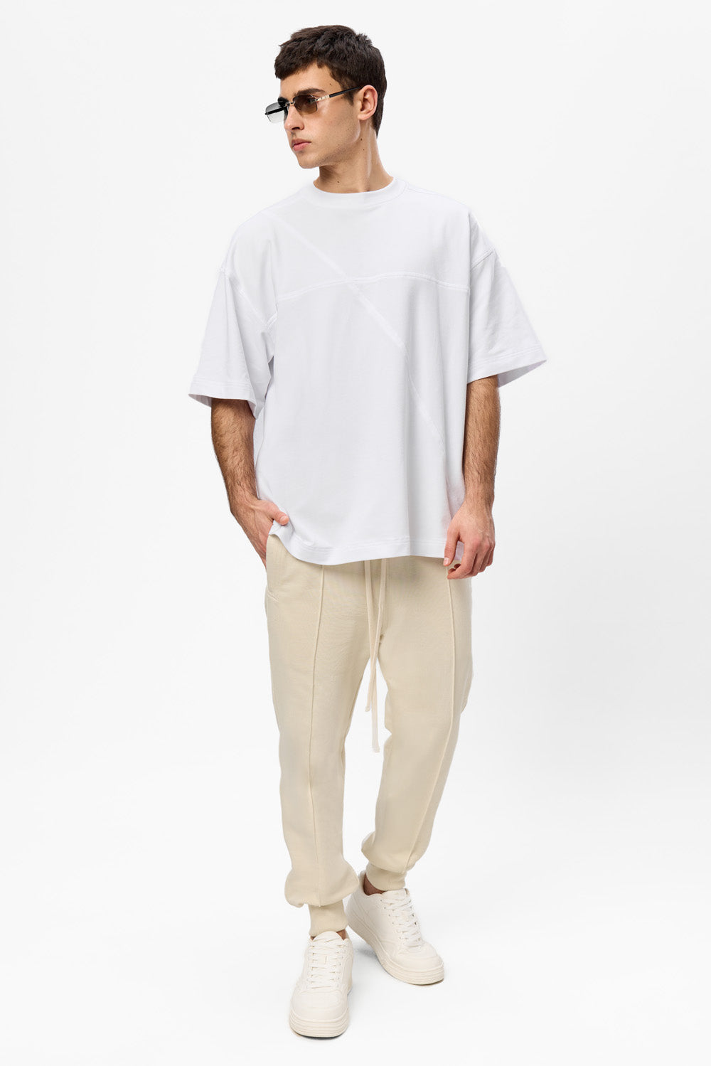 Oversized white T-shirt with decorative stitches