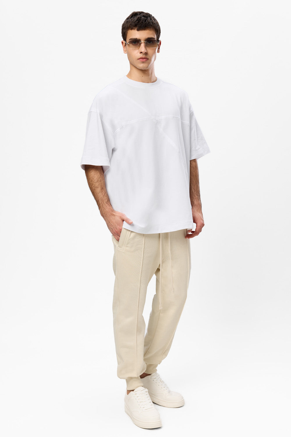 Oversized white T-shirt with decorative stitches