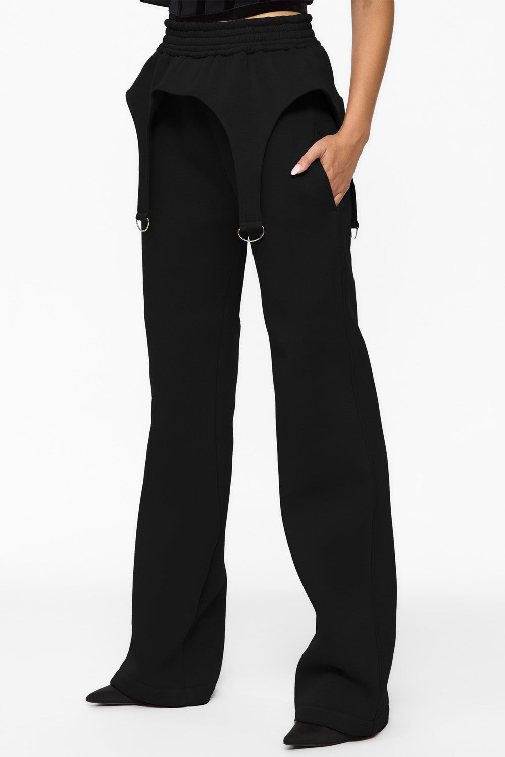 Black wide-leg pants worn by a person on a white background