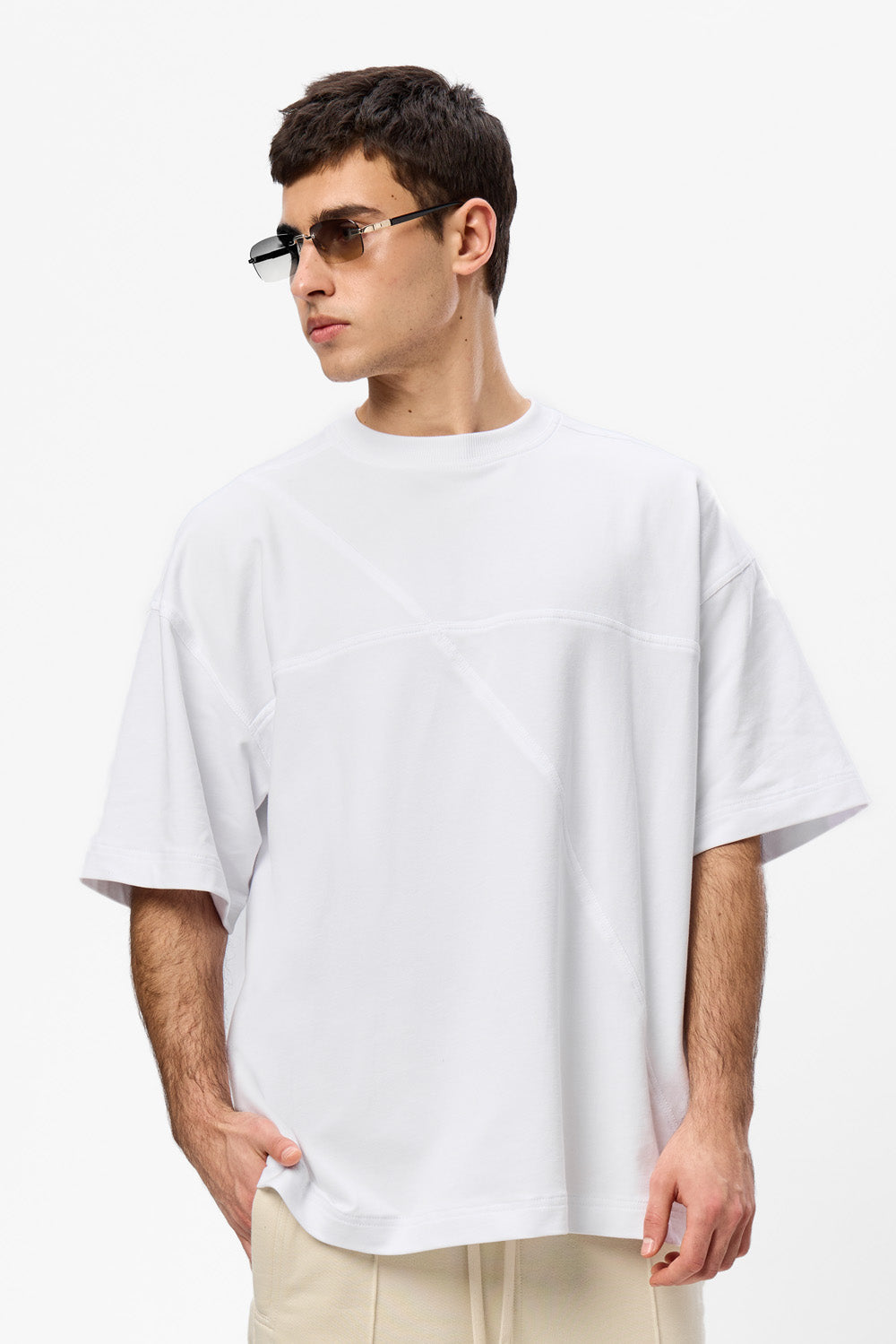 Oversized white T-shirt with decorative stitches