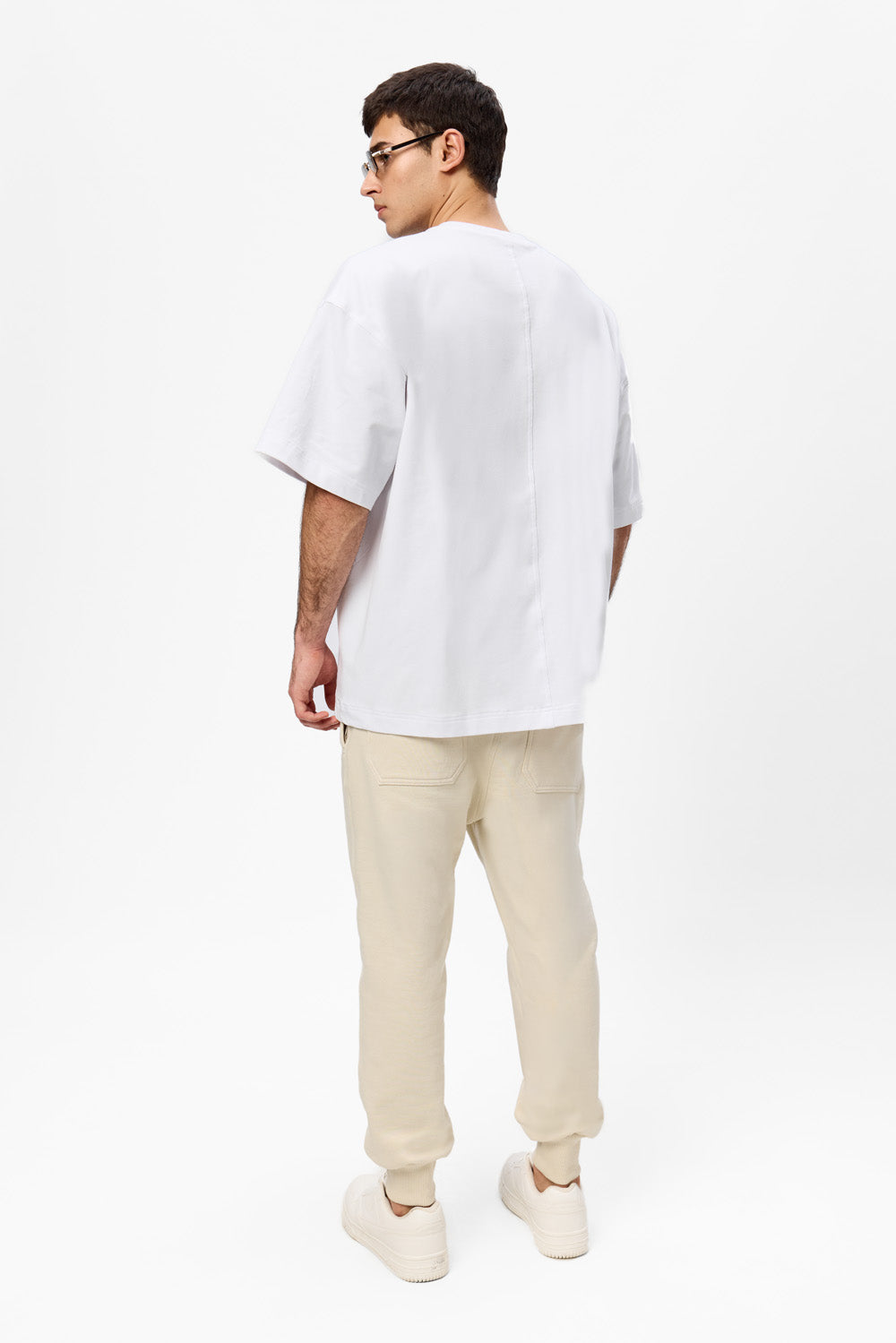 Oversized white T-shirt with decorative stitches