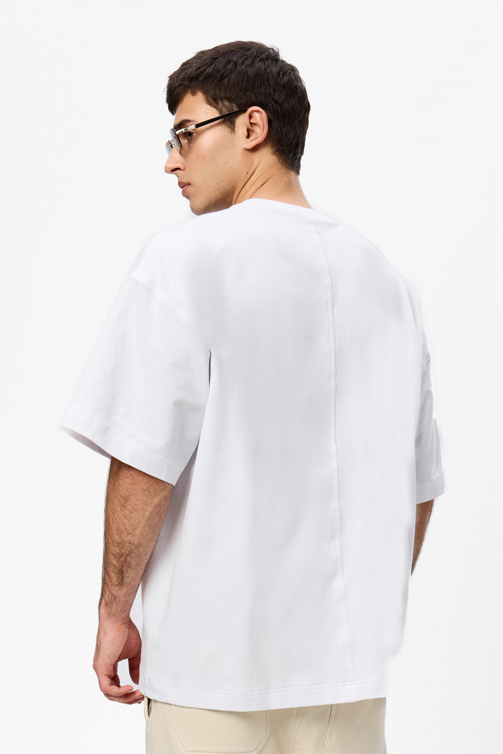 Oversized white T-shirt with decorative stitches