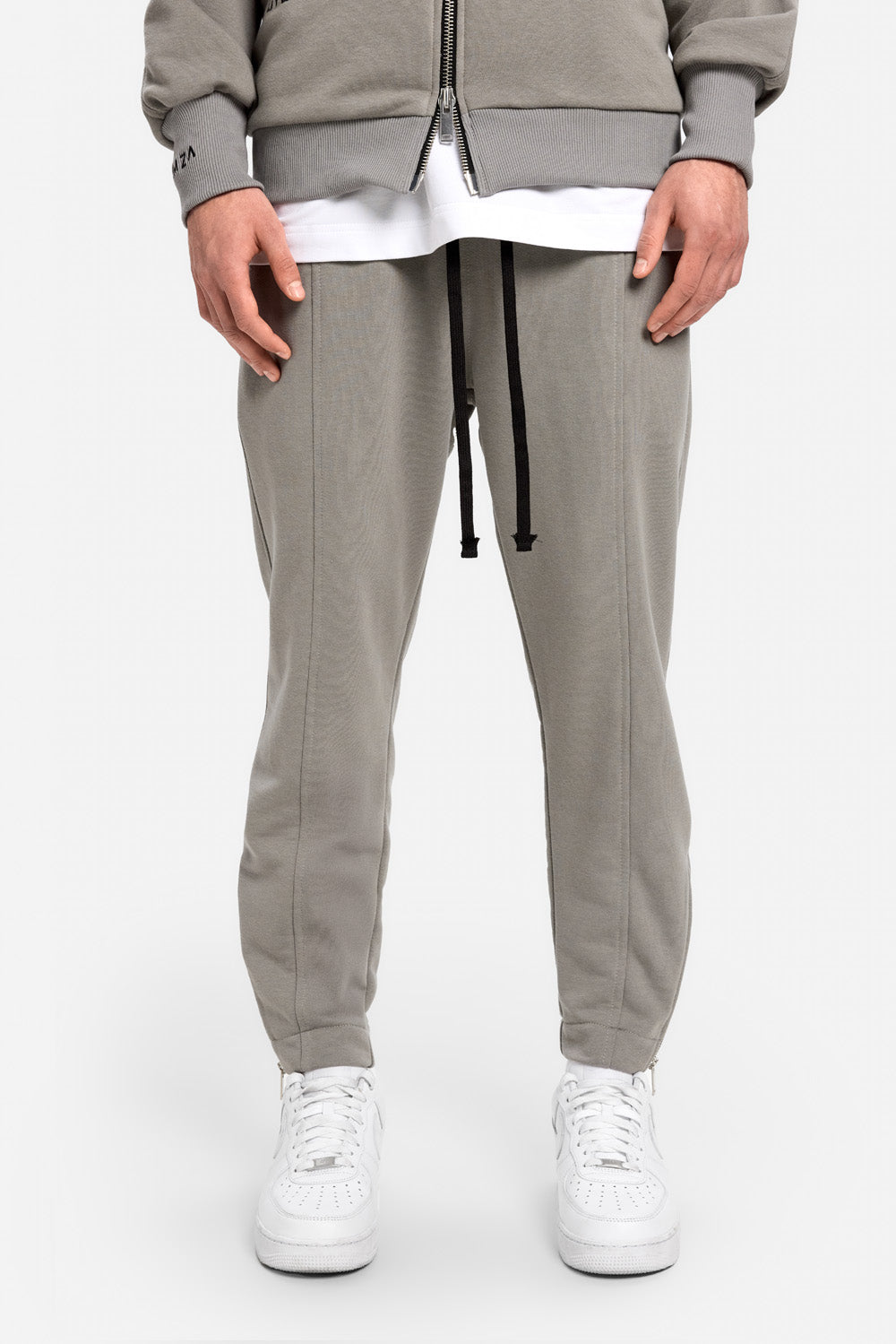 Pantaloni de trening gri cu fermoare si pathcuri Enigma