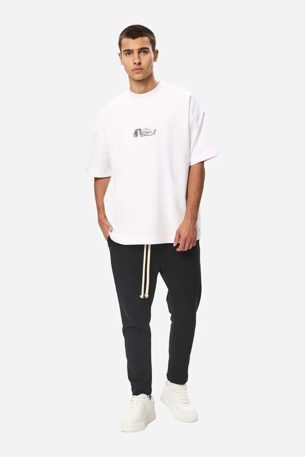 Full-body view of a model wearing the Line Art white boxy T-shirt for men